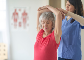 Occupational therapist helping a elderly woman