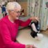 Elderly woman using the tilt to pour action of the Uccello Kettle