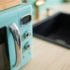 Blue Microwave beside the stovetop