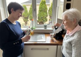 Elderly mother and daughter in the kitchen making tea with the Uccello Easy Pour Kettle