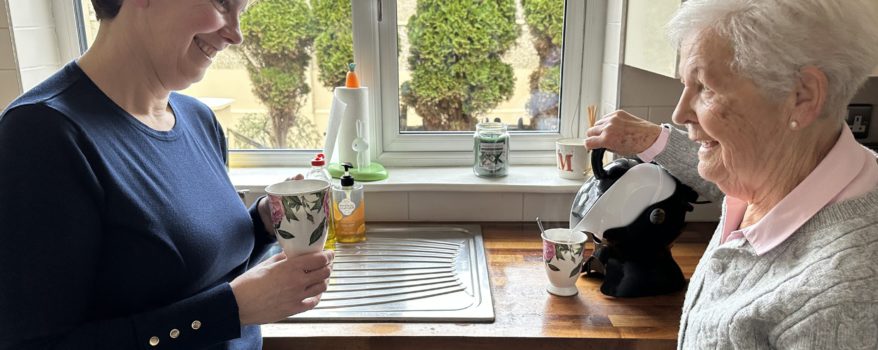 Elderly mother and daughter in the kitchen making tea with the Uccello Easy Pour Kettle